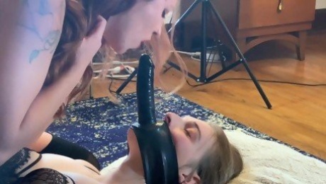 Domme Rides Pretty Girl with a Dildo Strapped to Face