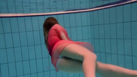 hot lady takes her lovely red dress and shows her body underwater
